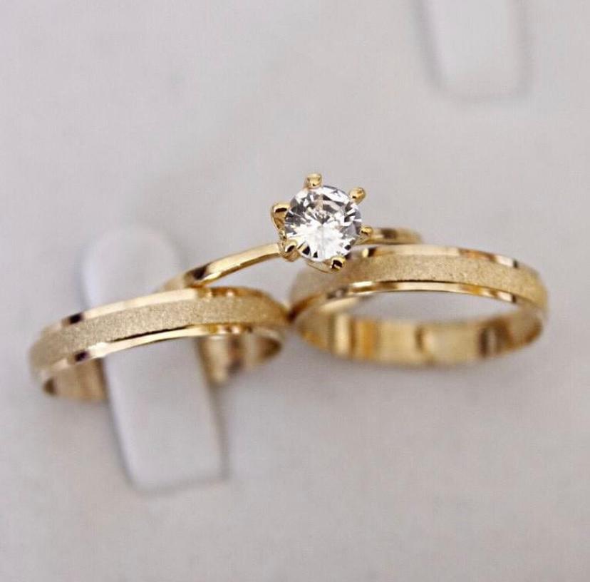 58c98359-746d-446c-a899-a115873fa2d5.jpg Par Alianças de Moedas Antiga Reta 4MM Jateada - Imagem 1